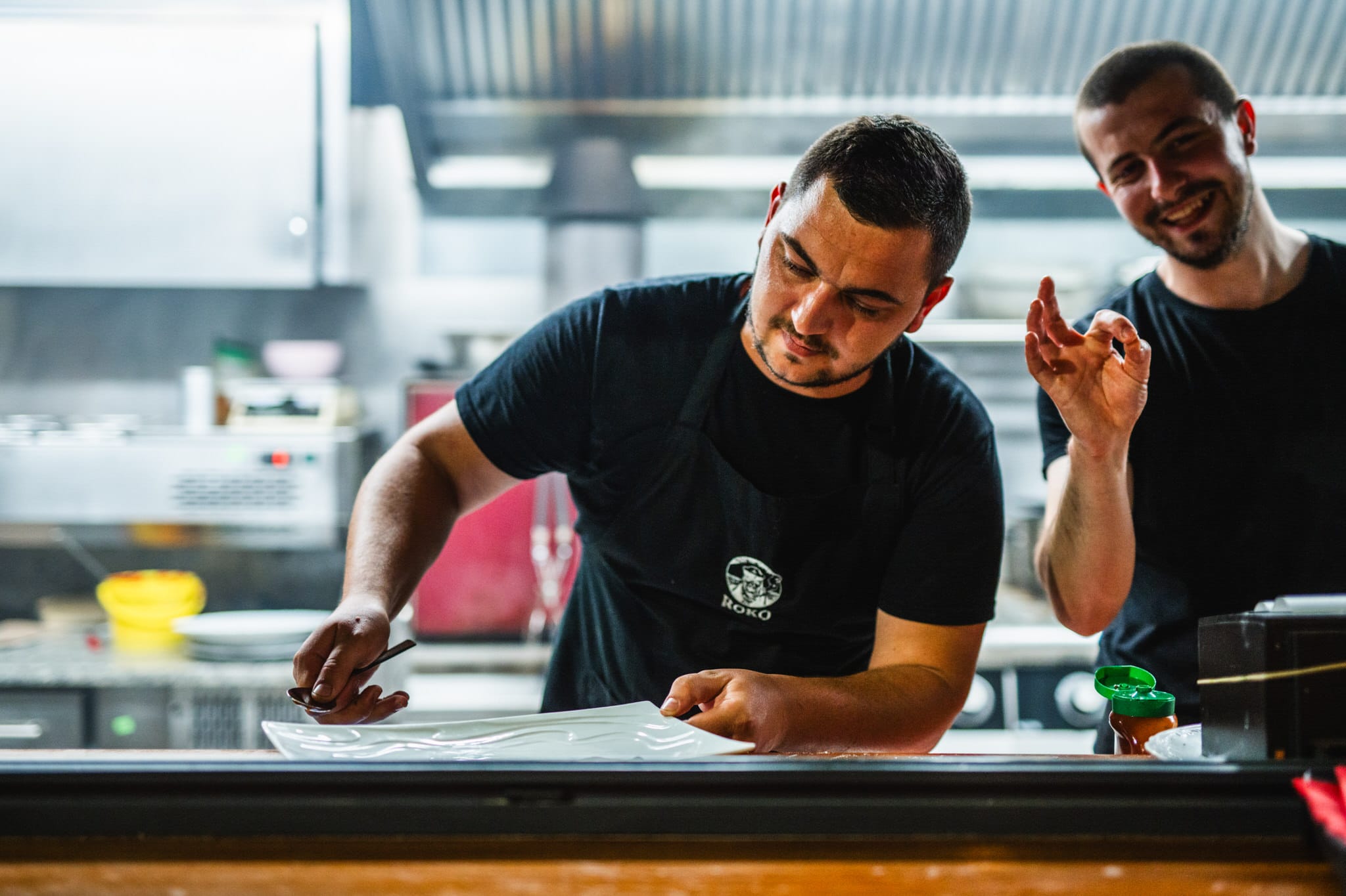 Roko chefs plating at the pass