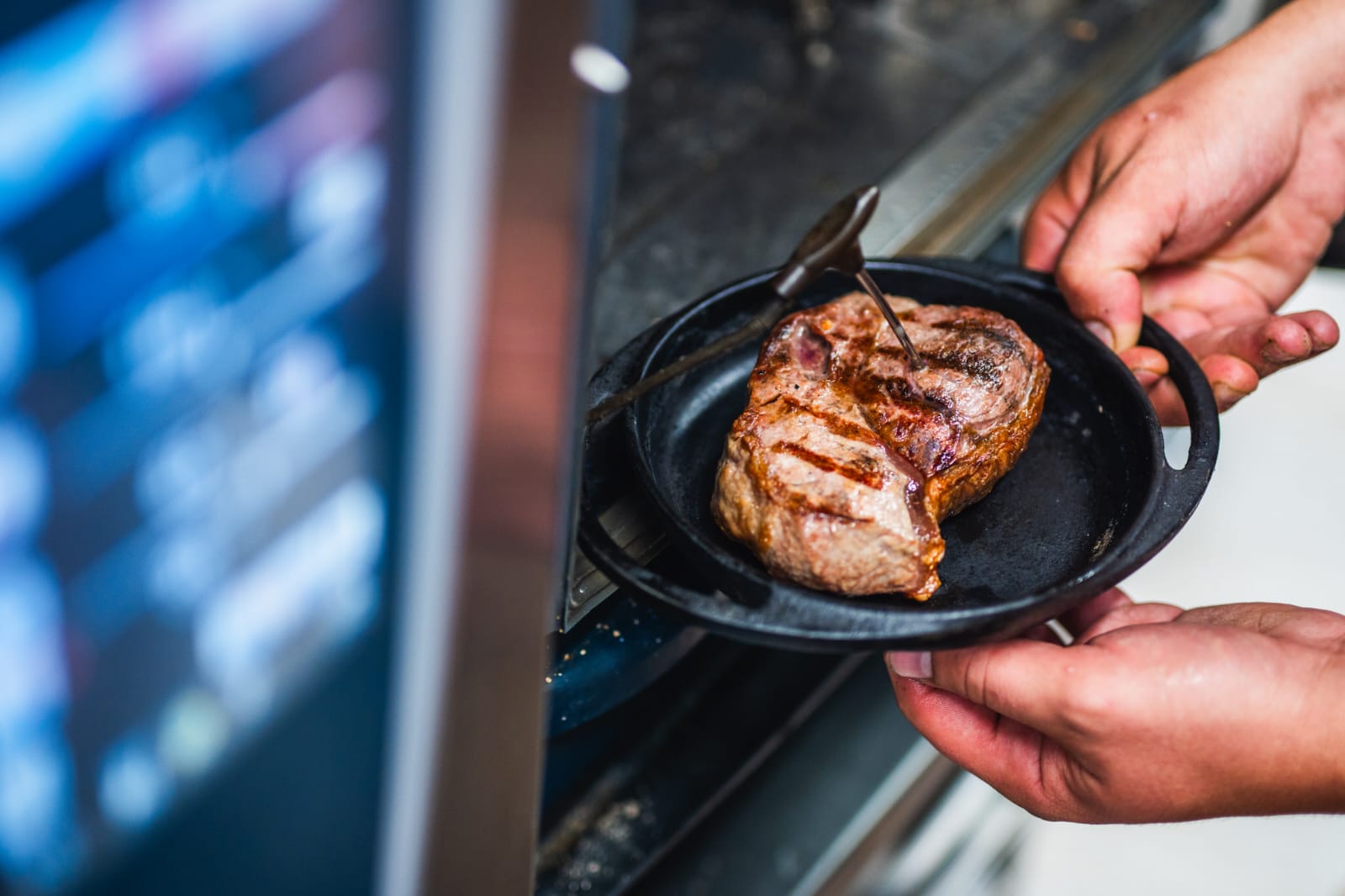 Seared steak resting in a cast iron pan