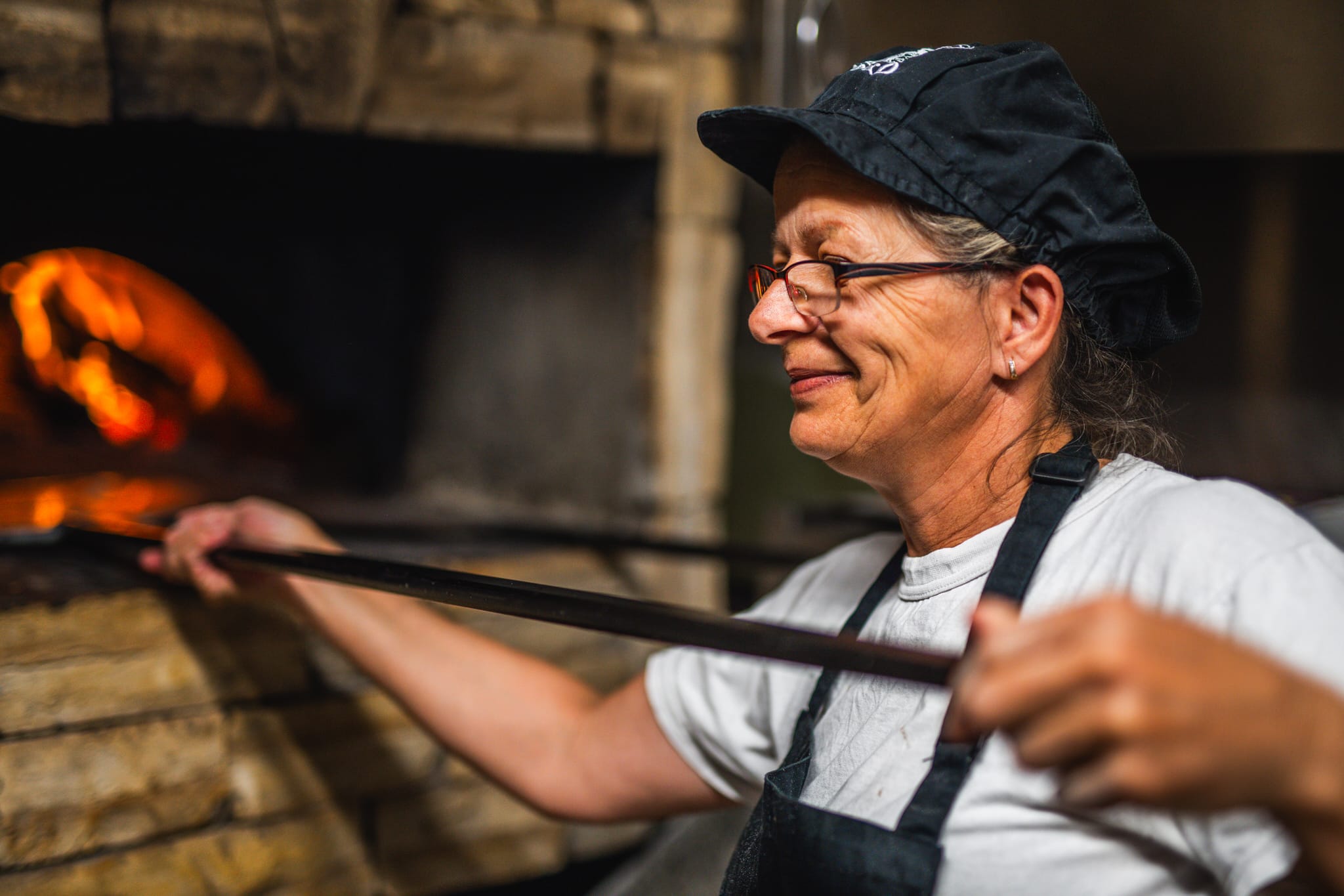 Tending the wood-fired oven