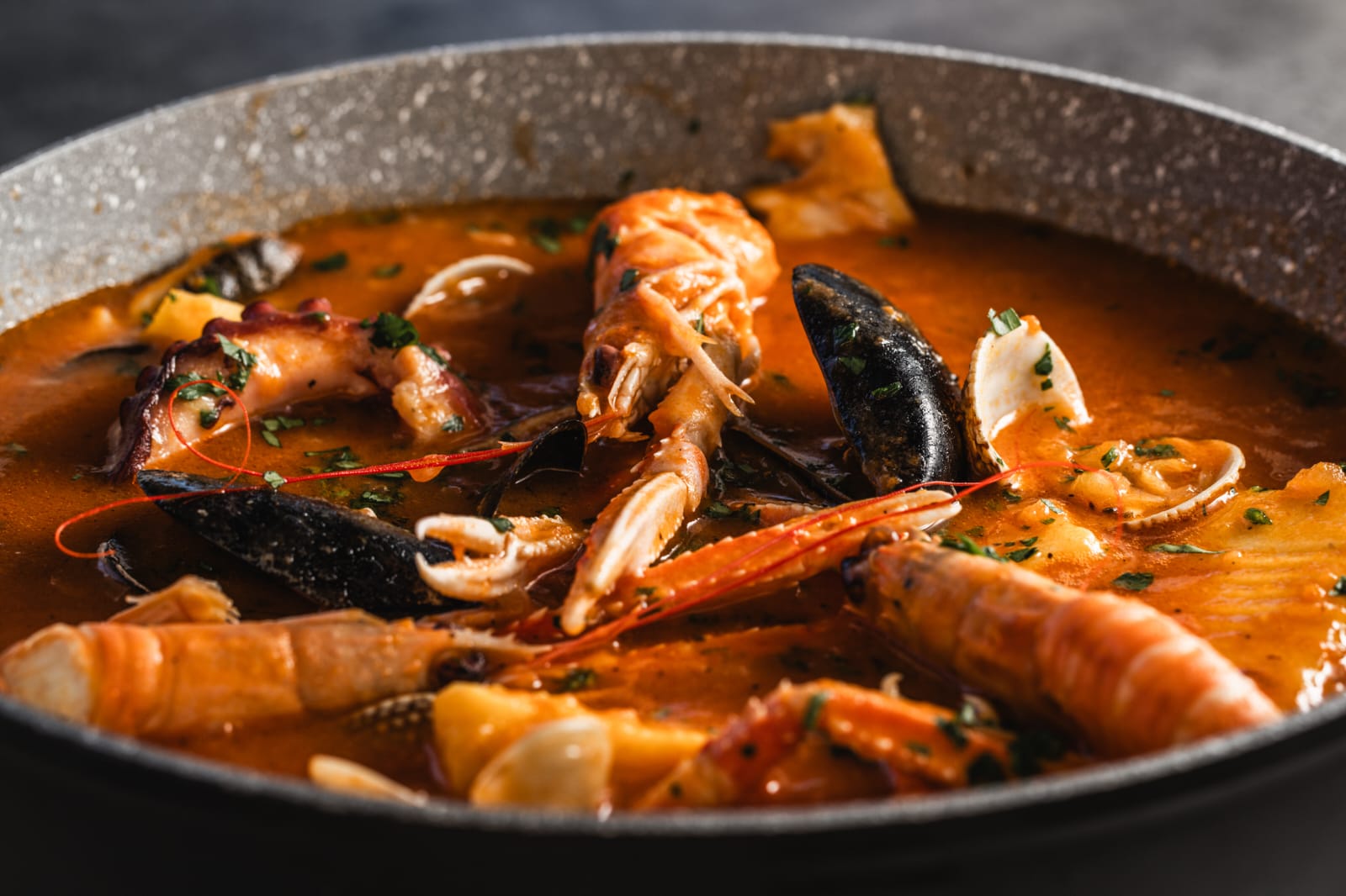 Adriatic seafood brodet in copper pan